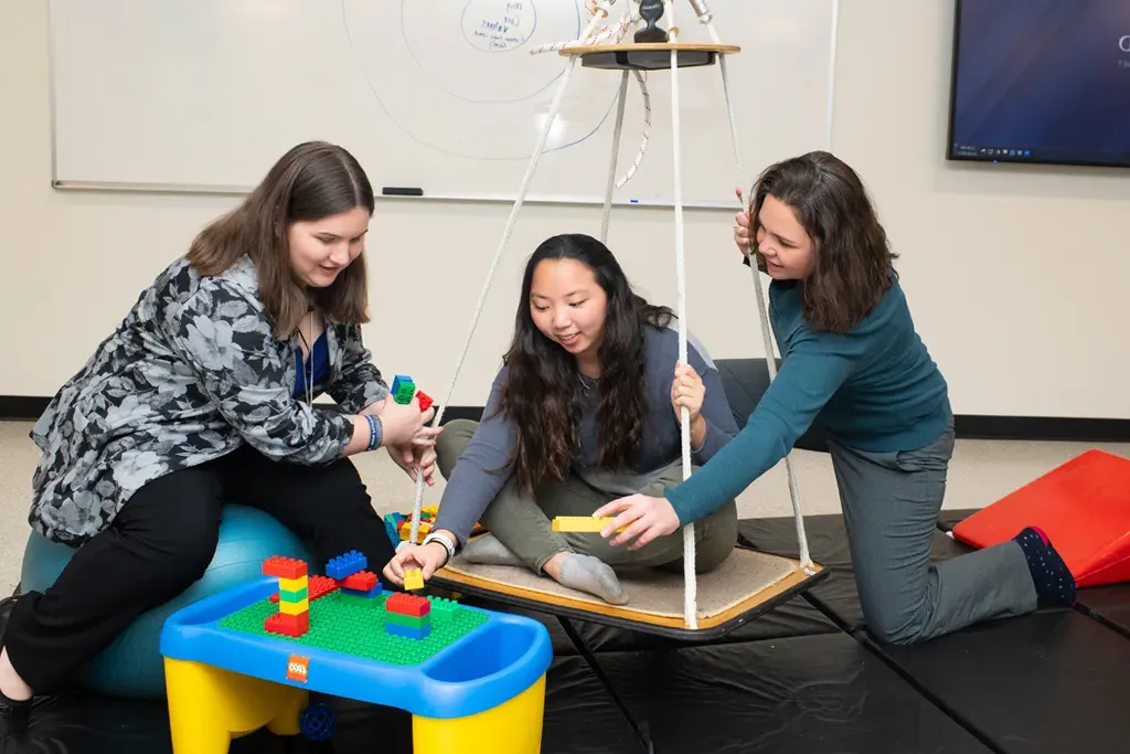 U N E occupational therapy students work with a patient